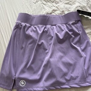 BACKCOUNTRY ATHLETIC SKIRT WITH SIDE ZIP AND POCKET.